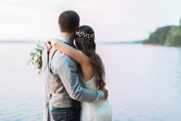 Bride and Groom embrace at elopement ceremony on Lake Jordan a must have wedding moment photo, MC Photography