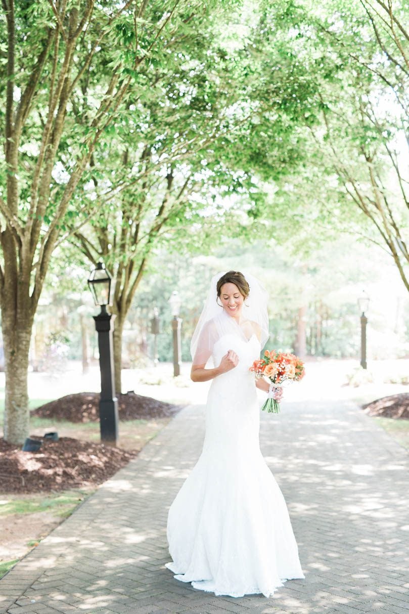 Bride-in-Rosa-Clara-fit-and-flare-gown-from-Traditions-by-Anna-and-flowers-by-Tre-Bella-at-wedding-at-The-Sutherland-in-NC-bowtie-collaborative