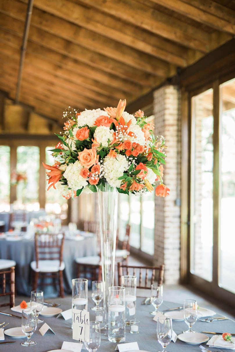 Orange-floral-tall-table-arrangement-at-The-Sutherland-by-Tre-Bella-bowtie-collaborative