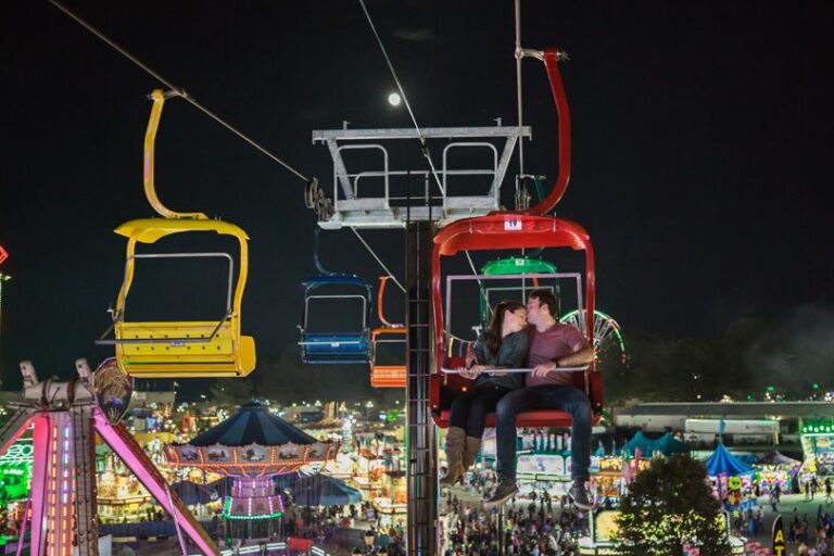 Raleigh Engaged Couple Engagement Photo Shoot at NC State Fair on Ferris Wheel by Richard Barlow