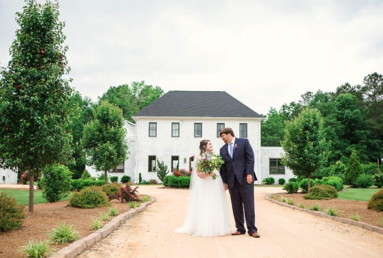 Bride and Groom pose in front of The Bradford, Raleigh Wedding Venue, Johanna Dye