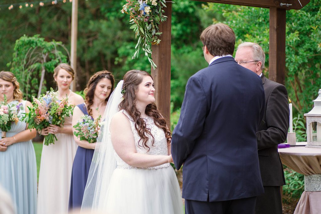 Bride and Groom saying I do in outdoor wedding at The Bradford, Raleigh Wedding Venue, Johanna Dye