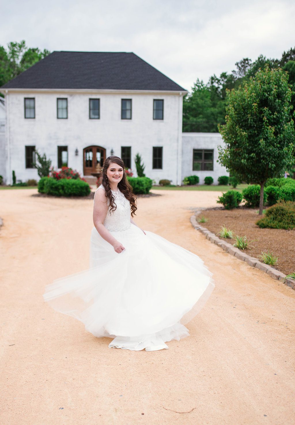 Bride dancing in front of The Bradford, Raleigh Wedding Venue, Johanna Dye