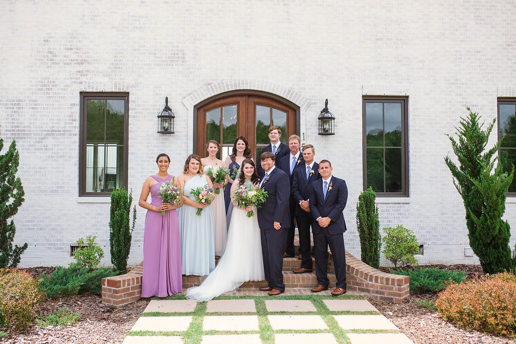 Wedding party poses outside of venue at The Bradford, Raleigh Wedding Venue, Johanna Dye