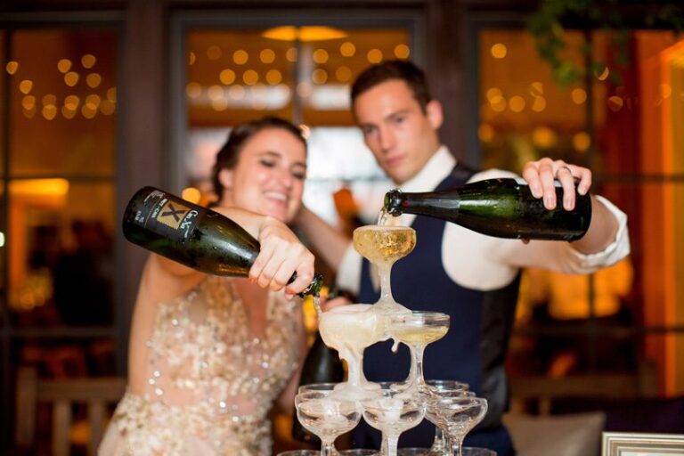 Bride and Groom pouring champagne fountain at NC wedding reception bartending services in Raleigh Durham NC Katherine Miles Jones