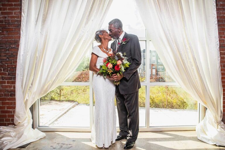 Bride and Groom Drapes Fall Wedding at Downtown Durham Wedding Venue Suite Four One Vision Photo