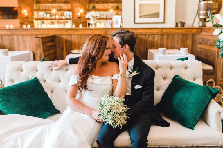 emerald green velvet pillows white couch wedding seating