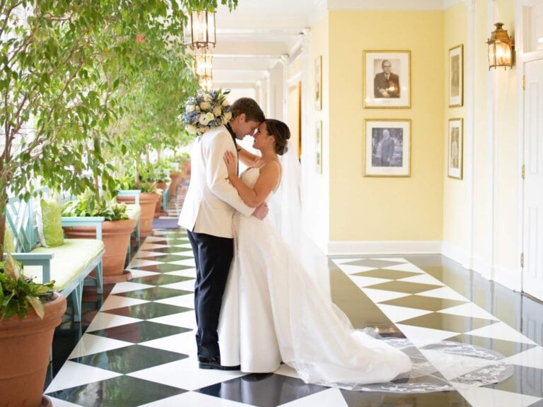 Couple shares a kiss in The Carolina Inn