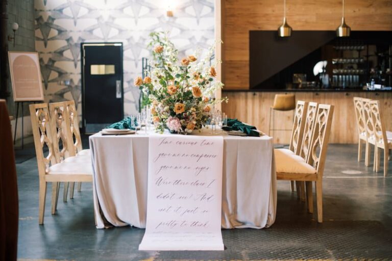 table setting floral arrangement calligraphy