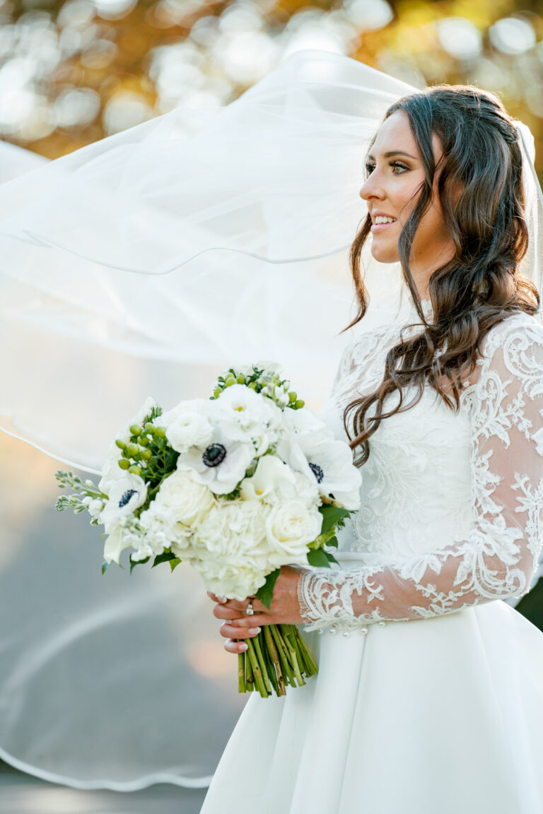 Outdoor bride portrait with white florals